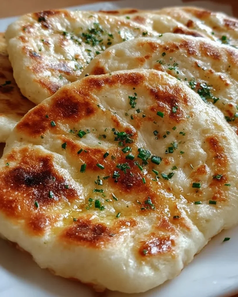 Homemade easy no-oven Turkish bread served on a wooden board.