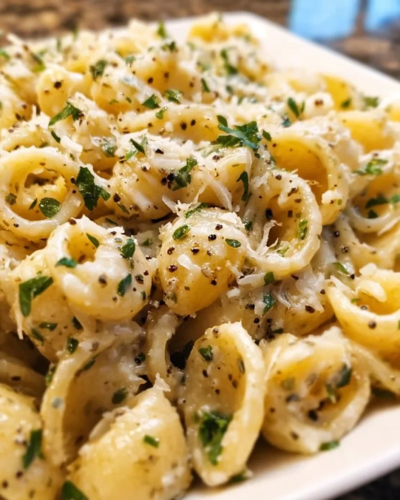Delicious Garlic Butter Pasta served with herbs and parmesan cheese