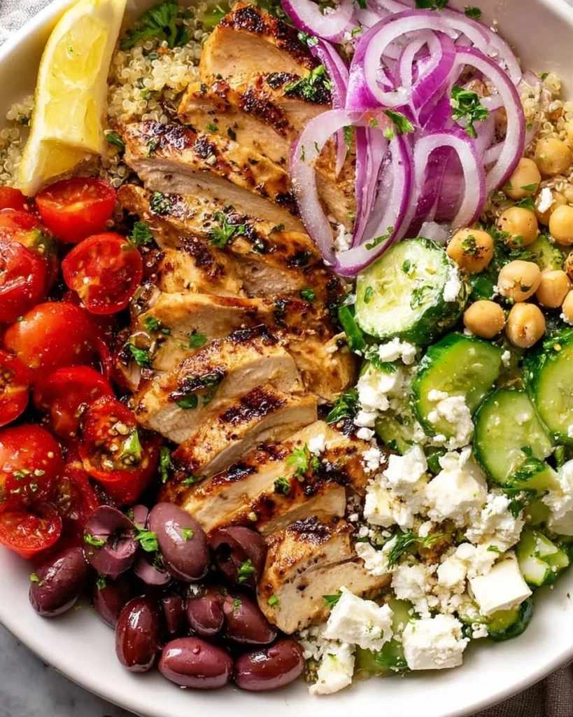 Greek Chicken Bowl with tender chicken, fresh vegetables, and zesty dressing