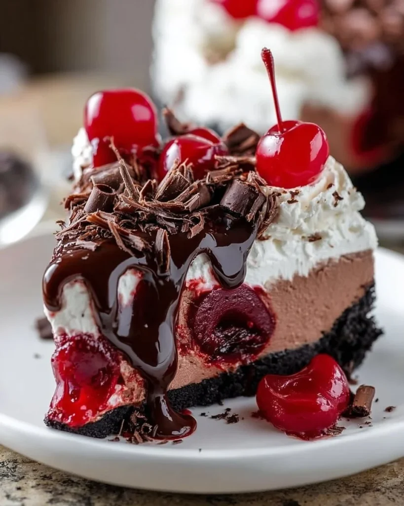 No Bake Black Forest Cheesecake topped with cherries and chocolate shavings