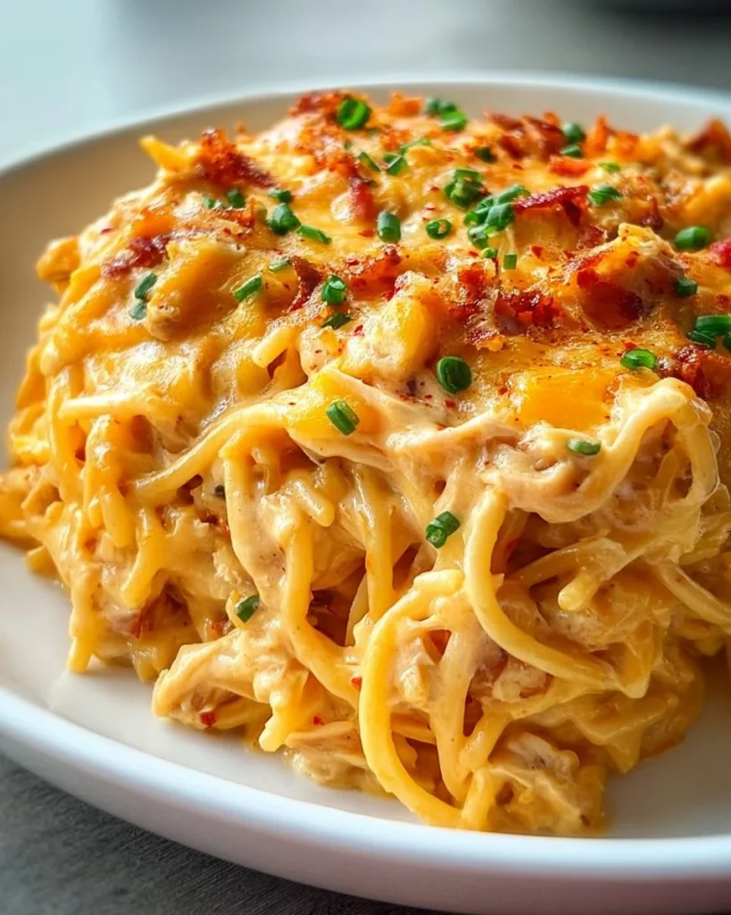 Spicy Southern cheesy chicken spaghetti casserole served in a dish