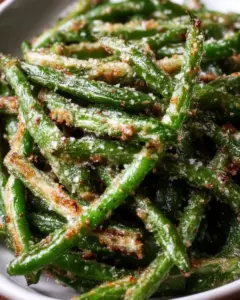 Crispy Air Fryer Parmesan Green Beans garnished and ready to serve.