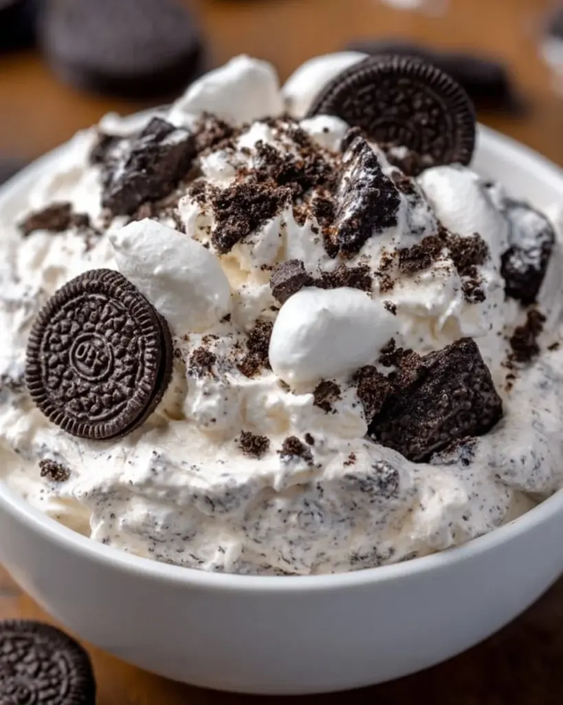Delicious bowl of Oreo Fluff dessert topped with crushed Oreos