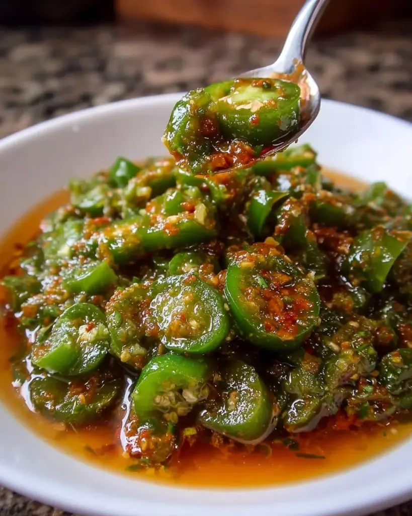 Zesty homemade jalapeño lime hot sauce in a small bottle with fresh ingredients