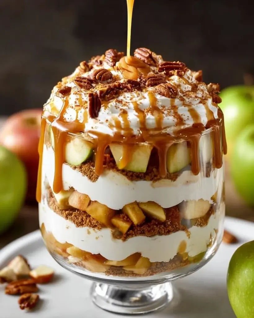 Delicious Caramel Apple Trifle dessert with layers of caramel, apples, and cream.