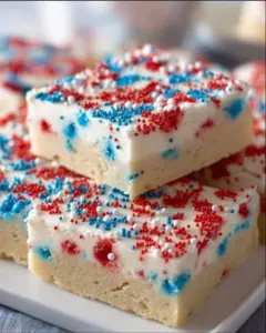 Delicious Patriotic Sugar Cookie Bars decorated with red, white, and blue icing