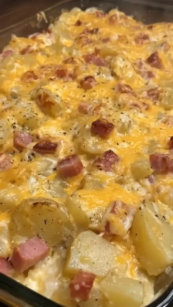 Delicious cheesy ham potato casserole baked to perfection.