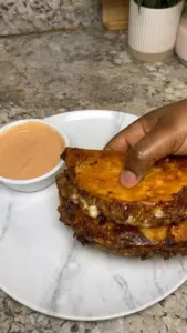 Crispy beef tacos topped with fresh ingredients and served on a plate