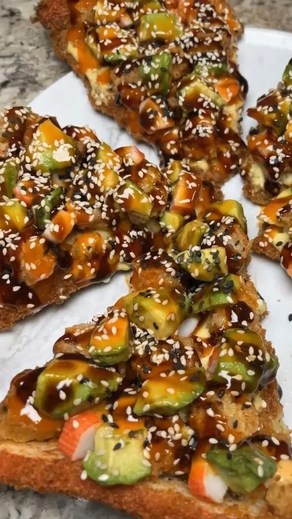 Crispy sushi pizza topped with fresh ingredients and unique flavors.