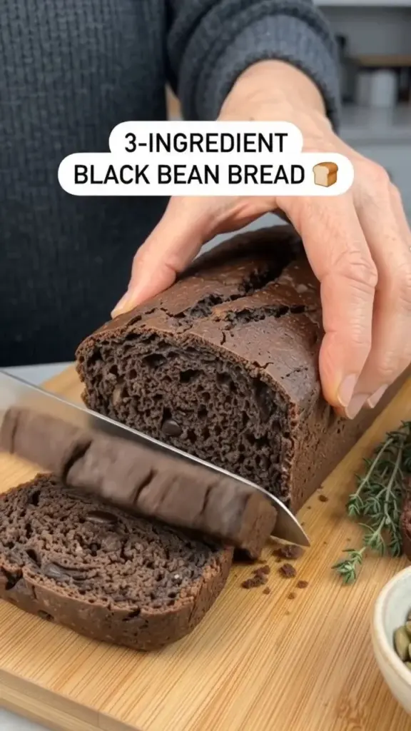 Loaf of high-protein black bean bread made with just three ingredients.