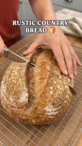 Homemade Rustic Country Bread fresh out of the oven with a crusty golden crust.