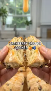 Freshly baked Cranberry Orange Vanilla Scones on a plate.